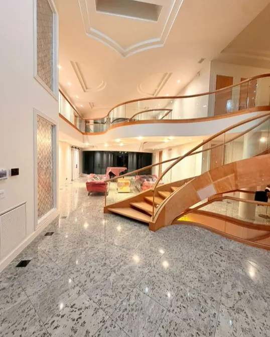 After: Staircase hall with curved railing